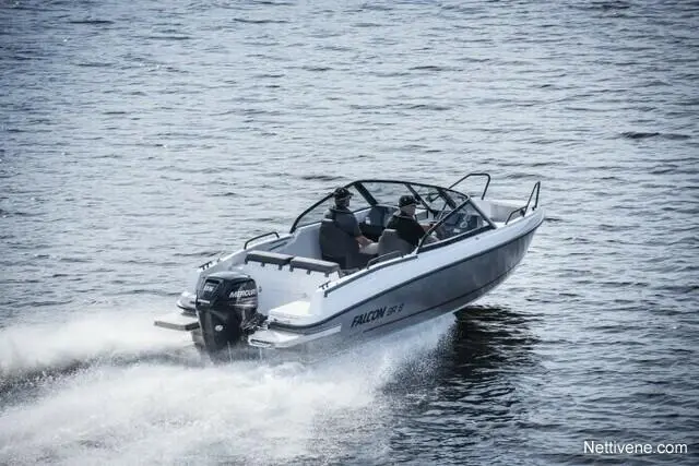 A motorboat named Falcon 17.5 speeds across a body of water with two passengers on board.